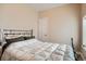 A simplistic designed bedroom featuring natural light and a comfortable bed at 2838 Decatur St, Denver, CO 80211