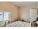 Bright bedroom filled with natural light, featuring a comfortable bed, and neutral decor at 2838 Decatur St, Denver, CO 80211