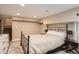 A neat bedroom featuring a bed, decorative lamps, and comfortable carpet at 2838 Decatur St, Denver, CO 80211