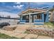 Charming blue duplex with a red tile roof and stone landscaping at 2838 Decatur St, Denver, CO 80211