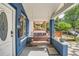 Cozy front porch featuring a swing, stylish lighting and lovely outdoor space at 2838 Decatur St, Denver, CO 80211
