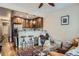 Open-concept living room and kitchen, with bar seating and hardwood floors at 2838 Decatur St, Denver, CO 80211