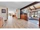 Spacious foyer leading to a bright living room with scenic views and stairs with unique metal decorative railing at 31762 Horseshoe Dr, Evergreen, CO 80439