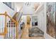 Elegant entryway with hardwood floors and staircase leading upstairs at 3026 W 111Th Dr, Westminster, CO 80031