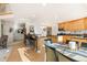 Modern kitchen with light wood cabinets and granite countertops at 3026 W 111Th Dr, Westminster, CO 80031