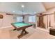 Finished basement game room with pool table, carpet, recessed lights and neutral walls at 6307 Saddle Bow Ave, Parker, CO 80134