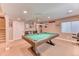 Finished basement game room with pool table, carpet, recessed lights and neutral walls at 6307 Saddle Bow Ave, Parker, CO 80134