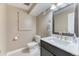 Neutrally decorated bathroom with a black vanity and gray countertop, modern sink, and updated fixtures at 6307 Saddle Bow Ave, Parker, CO 80134