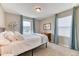 Cozy bedroom with soft lighting, plush bedding, and coordinating decor creating a relaxing space at 6307 Saddle Bow Ave, Parker, CO 80134