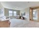 Spacious bonus room providing a relaxed atmosphere, with soft carpeting, a comfy sofa, and ample natural light at 6307 Saddle Bow Ave, Parker, CO 80134