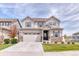 Beautiful home showcasing craftsman-style architecture, landscaping, and inviting front lawn at 6307 Saddle Bow Ave, Parker, CO 80134