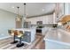 Beautiful kitchen with a center island, modern pendant lighting and stainless steel appliances at 6307 Saddle Bow Ave, Parker, CO 80134