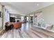Spacious living room featuring hardwood floors, fireplace, and elegant furnishings with great natural light at 6307 Saddle Bow Ave, Parker, CO 80134