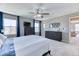 Bright main bedroom featuring plush carpets, modern furnishings, and large windows with scenic views at 6307 Saddle Bow Ave, Parker, CO 80134