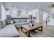 Bright and airy living room with open floor plan and hardwood floors at 1397 Hart Ln, Elizabeth, CO 80107