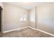Cozy bedroom with neutral walls, carpet, and plenty of light at 530 Hickory St, Hudson, CO 80642