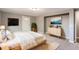 Serene bedroom with soft carpet, artwork, and plenty of natural light at 530 Hickory St, Hudson, CO 80642