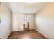 Empty room with neutral walls, wood floors, and water access pipes at 530 Hickory St, Hudson, CO 80642