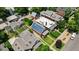Aerial view showcases a brick home with solar panels amidst a vibrant neighborhood setting at 461 S Sherman St, Denver, CO 80209