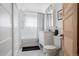Well-lit bathroom featuring a tiled floor, vanity, toilet, and a shower/tub combination with white subway tile surround at 461 S Sherman St, Denver, CO 80209