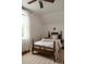Bright bedroom with a charming wooden bed, neutral tones, and a sunlit window, creating a cozy and inviting space at 461 S Sherman St, Denver, CO 80209