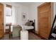 Cozy bedroom showcasing a decorative bed, a soft ottoman, and a vintage door, creating a warm ambiance at 461 S Sherman St, Denver, CO 80209