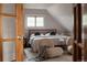 Bright bedroom with a bed, decorative pillows, and cozy chairs at 461 S Sherman St, Denver, CO 80209