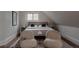 Bright bedroom featuring stylish seating, neutral tones, a patterned rug, and natural light, creating a relaxing atmosphere at 461 S Sherman St, Denver, CO 80209