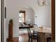 An archway leads from the dining area into the living room with hardwood floors and modern accents at 461 S Sherman St, Denver, CO 80209