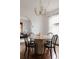 Chic dining room with a unique modern chandelier and minimalist table setting at 461 S Sherman St, Denver, CO 80209