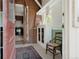 Inviting entryway featuring exposed brick wall, wooden floors, and a view into the cozy kitchen at 461 S Sherman St, Denver, CO 80209