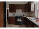 Bright kitchen with granite countertops, updated appliances, tile backsplash, and ample cabinet space at 461 S Sherman St, Denver, CO 80209