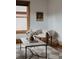 Cozy living room featuring an elegant chair, modern lighting, and a beautiful view from the window at 461 S Sherman St, Denver, CO 80209