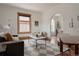 Cozy living room featuring stylish furnishings, arched doorway, and neutral decor at 461 S Sherman St, Denver, CO 80209