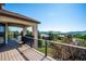 Covered balcony features dining area and mountain views at 16134 Sandstone Dr, Morrison, CO 80465