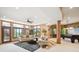 A finished basement with sitting area, walk-out access, and a billiards table at 16134 Sandstone Dr, Morrison, CO 80465
