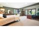 Spacious bedroom with sitting area and natural light at 16134 Sandstone Dr, Morrison, CO 80465