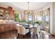 Cozy breakfast nook with scenic views and stylish light fixture at 16134 Sandstone Dr, Morrison, CO 80465