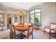 Formal dining room features a large window with mountain views at 16134 Sandstone Dr, Morrison, CO 80465