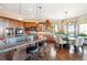 Spacious kitchen boasts custom cabinets and eat-in breakfast nook at 16134 Sandstone Dr, Morrison, CO 80465
