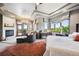 Spacious main bedroom boasts a fireplace, large windows and access to a balcony at 16134 Sandstone Dr, Morrison, CO 80465