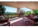 Balcony with wood furniture offers scenic mountain views and a relaxing outdoor space at 16134 Sandstone Dr, Morrison, CO 80465