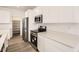 Well-equipped kitchen featuring stainless steel appliances, white countertops, and ample cabinet space at 2138 S Haleyville Way, Aurora, CO 80018