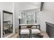 Bright home office featuring a large window, modern desk and seating, and sleek decor at 5814 Cole Way, Arvada, CO 80004