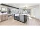 Modern kitchen with large island, stainless steel appliances, and an open floor plan at 5814 Cole Way, Arvada, CO 80004