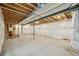 Large unfinished basement features exposed ceiling and white plastic-wrapped walls over insulation at 8785 Whiteclover St, Littleton, CO 80125
