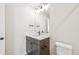 The well-lit bathroom has modern vanity, stylish fixtures, and a comfort height toilet at 8785 Whiteclover St, Littleton, CO 80125