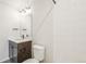 Bright bathroom features modern vanity, stylish fixtures, tile shower, and comfort height toilet at 8785 Whiteclover St, Littleton, CO 80125