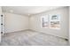 Bedroom featuring plush carpet and large windows at 8785 Whiteclover St, Littleton, CO 80125