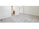 Bedroom featuring plush carpet and a bathroom doorway at 8785 Whiteclover St, Littleton, CO 80125
